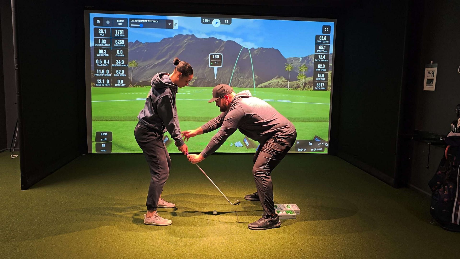 Katara working with golf coach Derrick Campbell